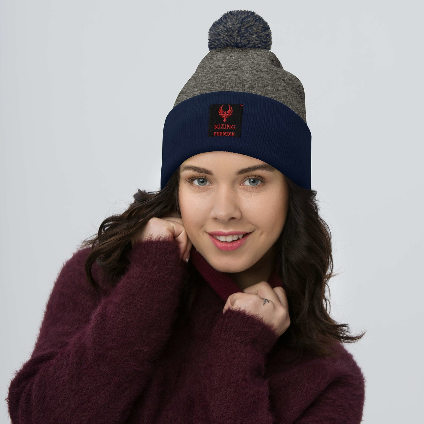 RIZING FEENIXX™ POM-POM BEANIE