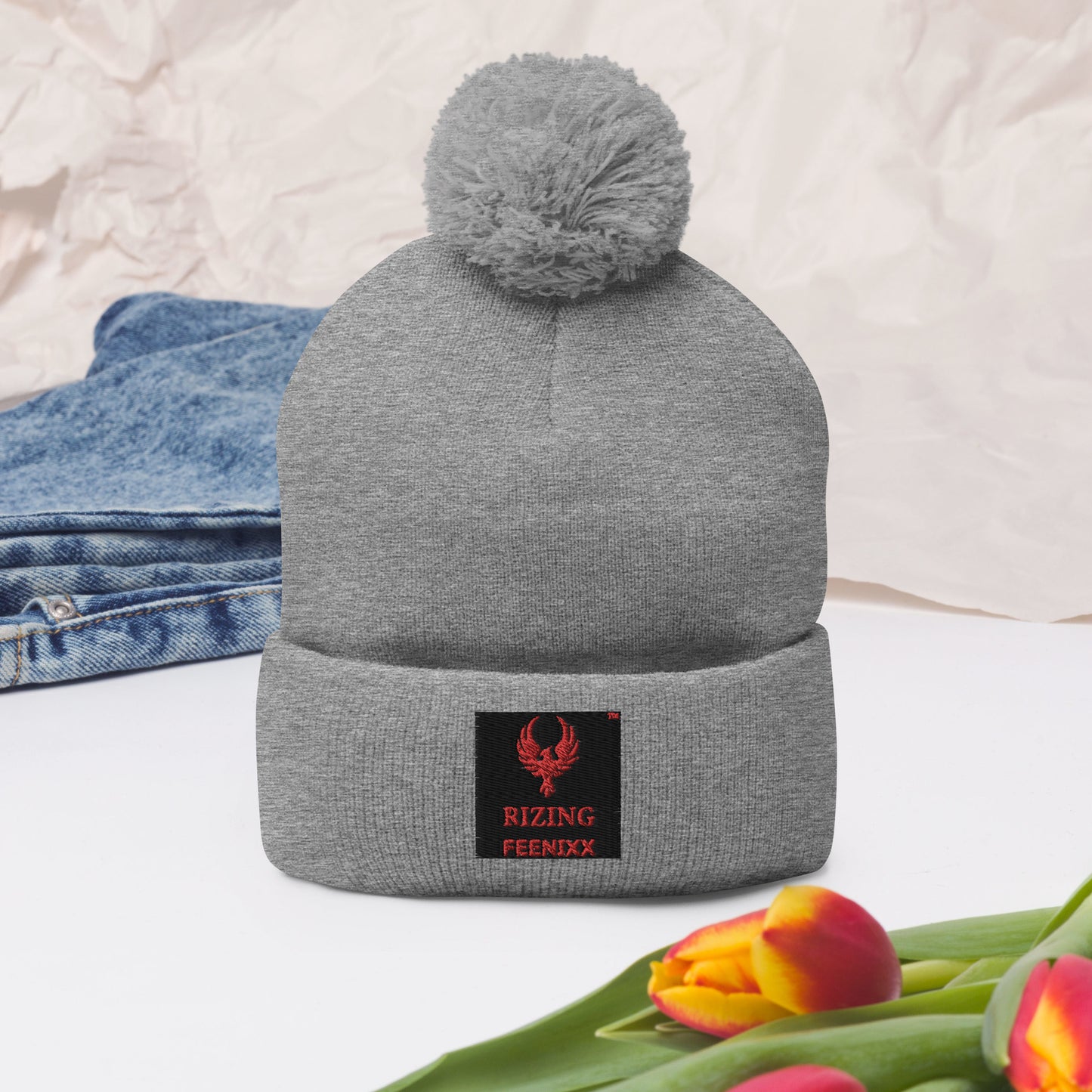RIZING FEENIXX™ POM-POM BEANIE